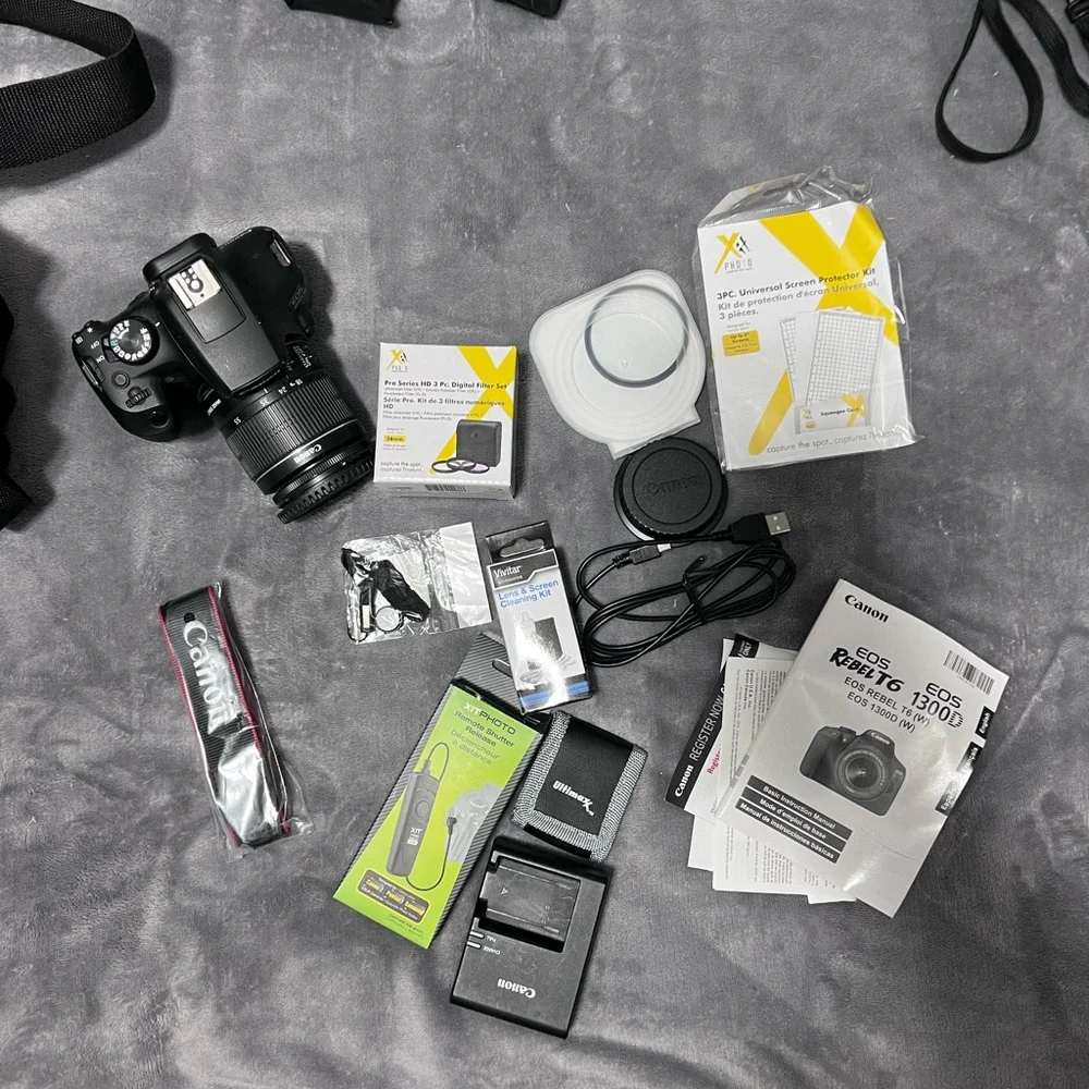 Canon Camera and a full kit with a bag and two additional lenses